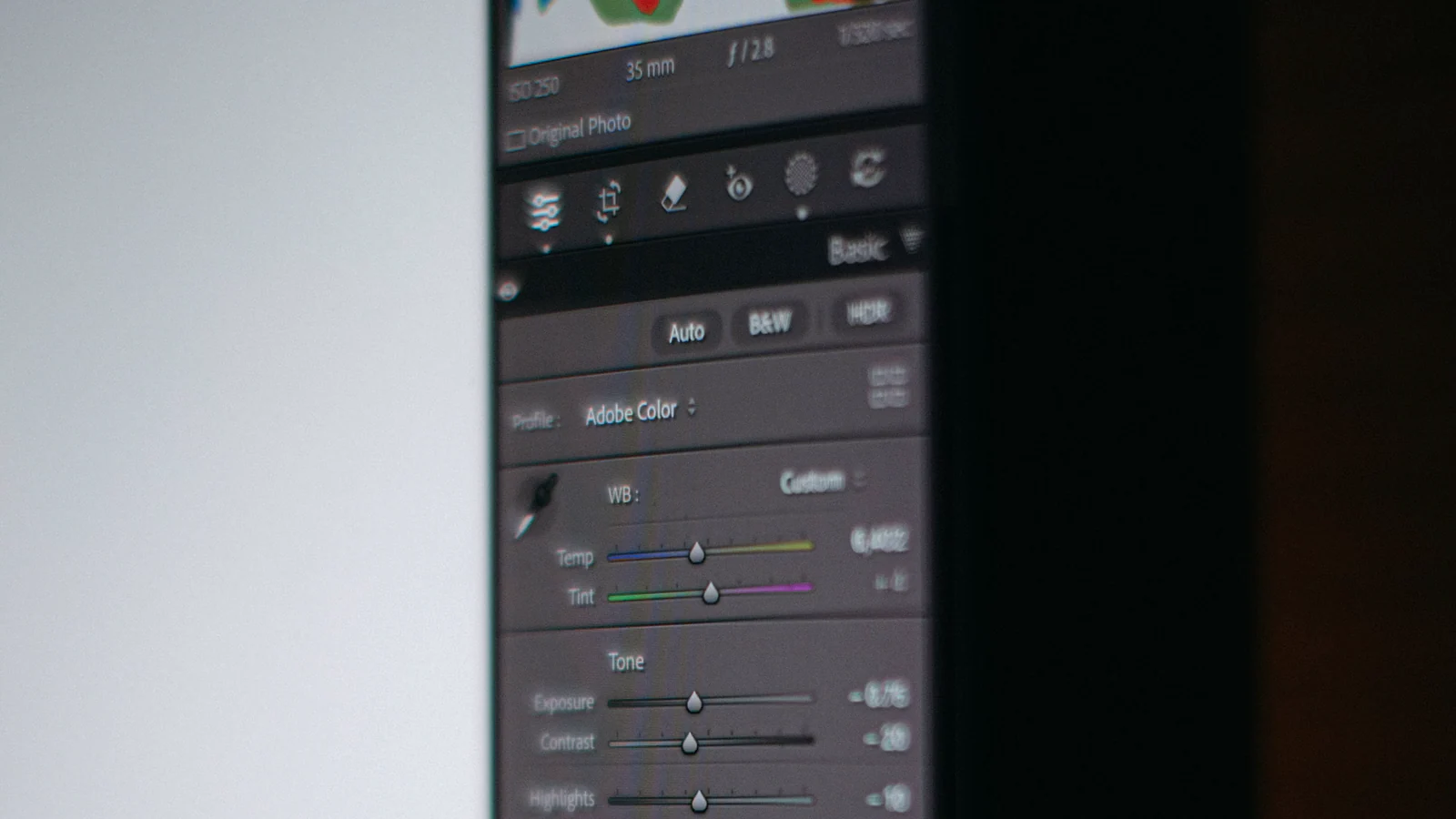 Close-up of photo editing controls on a monitor